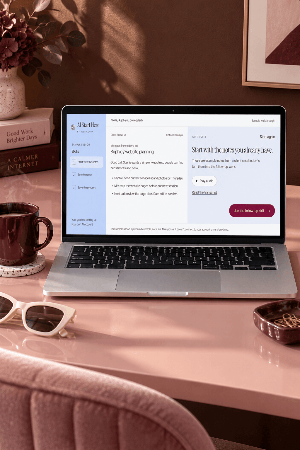 AI Start Here sample lesson on a laptop at a blush desk, with a burgundy coffee cup